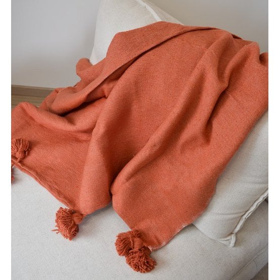 Poufs & Kissen – Orangefarbene Pompom-Decke